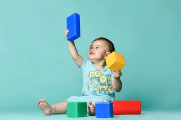 Fotobehang Lego little boy child toddler playing with block toys  © FAB.1