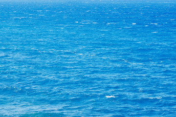 Natural background blue sea with waves, azure clear water beach
