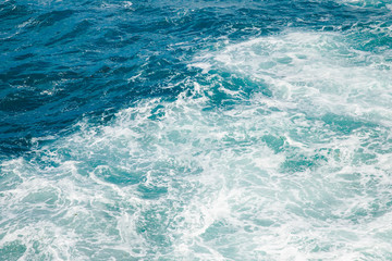 Fototapeta na wymiar Natural background blue sea with waves, azure clear water beach