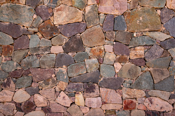 Detail of a natural stone wall, as a background