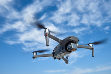 Naklejka na ściany i meble drone flying with the sky in the background