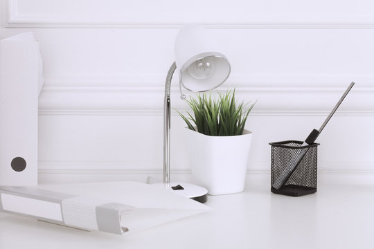 White And Stylish Home Interior With Cool Office Accessories, Notes, Boxes, Pencils And Air Plant.