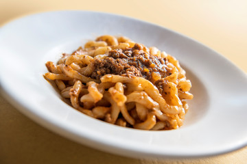 Tuscan pici pasta dish with meat sauce