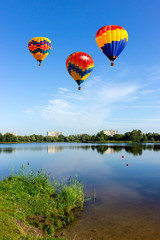 Balloon flying over the lake.