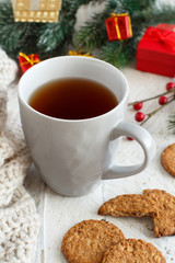 Christmas composition with tea mug and cookies