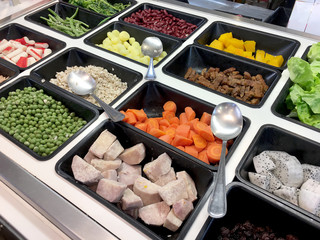Fresh salad bar with various fresh assortment of ingredients, fruits and proteins Variety of vegetable set for display space of the options for the choice of clients in the supermarket. Take yourself