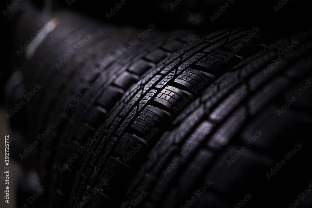 Wall mural closeup photo shoot of new unused car's tyres with bold specific texture.