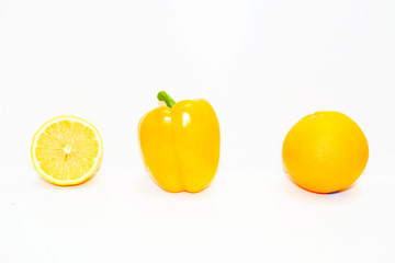 orange and lemon and yellow pepper  on white background