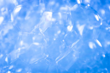 Beautiful abstract texture color white and blue bubbles background in water on blue background pattern clear soapy shiny