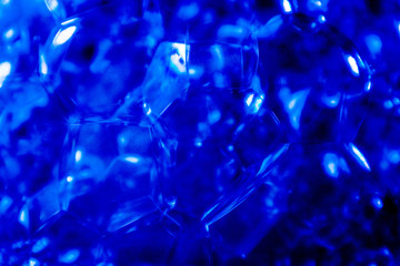 Beautiful abstract texture color white and blue bubbles background in water on blue background pattern clear soapy shiny