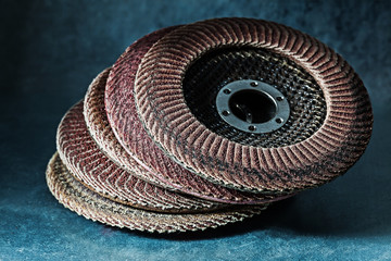 old used abrasive flap discs on metalic background