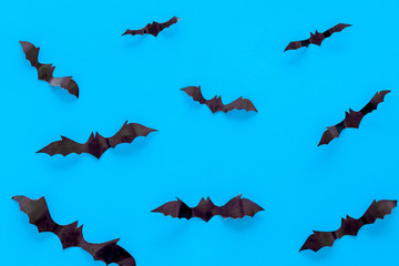 Halloween background with bats on blue table top view