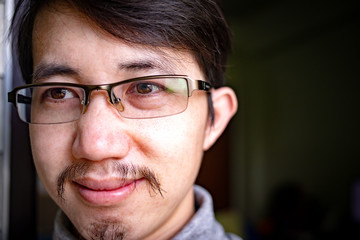 Fototapeta na wymiar Close up face of Asian man with eyeglasses