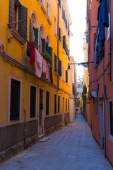 Fototapeta na wymiar Venice Italy morning sunny street with laundry washed clothes hanging out to dry on ropes