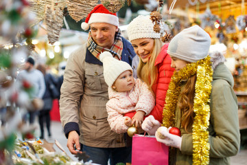 Family buying Christmas decorations