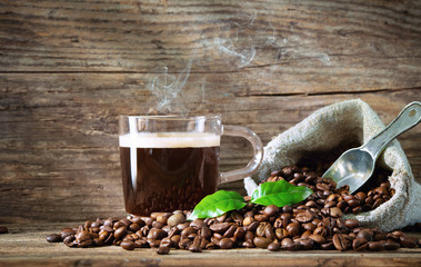 Cup of breakfest coffee with coffee beans