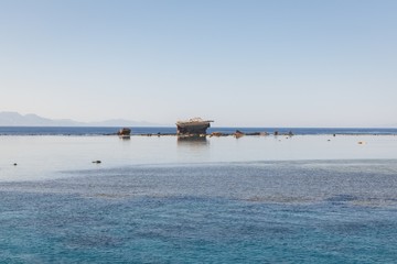 Seascape with junk ship on the horizon