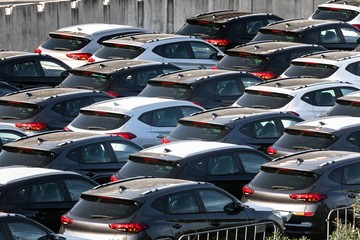 Lot of cars being transported to trade location