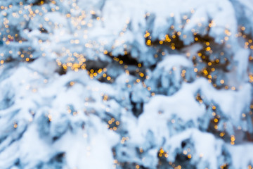 Shimmering blur background with shining lights and snow