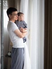 Fototapeta premium cute asian seven month baby in white dress smiling