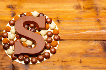 Celebration of Saint Nicholas, patron saint of children in Netherlands, Belgium, Luxembourg and North of France in first week of December, chocolate letters S and ginger cookies