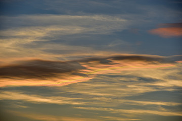 sunset in the sky with a pink cloud 