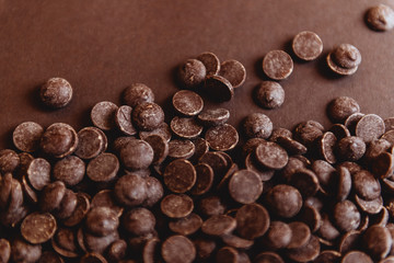 milk chocolate pieces preform candies in daylight for background