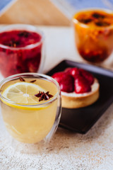 Strawberry tasty tart served with herbal teas and fruits