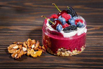 Breakfast with oatmeal, fruit and walnuts