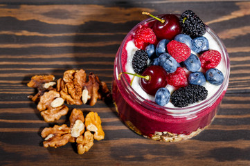 Breakfast with oatmeal, fruit and walnuts