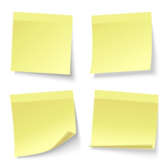 Blank note papers, pinned with a push pin.  Empty white pages. 