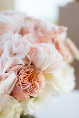 Wedding flowers, bridal bouquet closeup. Decoration made of roses, peonies and decorative plants, close-up, selective focus, nobody, objects
