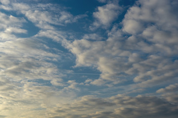 Clouds against blue sky. Dramatic background.