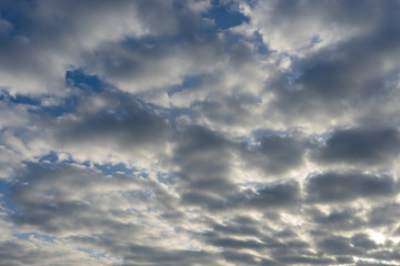 Clouds against blue sky. Dramatic background.
