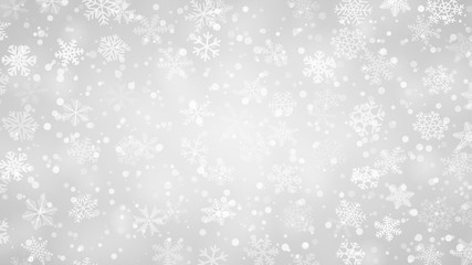 Christmas background of snowflakes of different shapes, sizes and transparency in gray colors