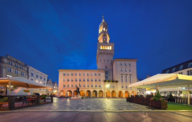Opole, Poland. View of Rynek square with building of Town Hall at dusk - obrazy, fototapety, plakaty