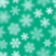 Fototapeta na wymiar Christmas seamless pattern of white defocused snowflakes on turquoise background