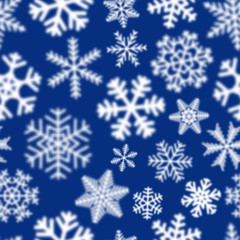 Naklejka na ściany i meble Christmas seamless pattern of white defocused snowflakes on blue background