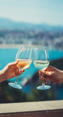 Drink two glasses white wine hands outdoor sea nature holidays, romantic couple toast with alcohol, people cheering fun vacation enjoying travel time together friendship love concept congratulations - obrazy, fototapety, plakaty