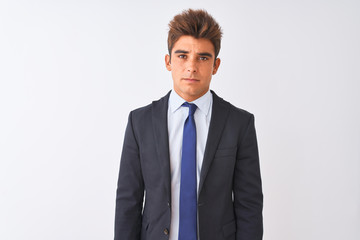 Young handsome businessman wearing suit standing over isolated white background depressed and worry for distress, crying angry and afraid. Sad expression.