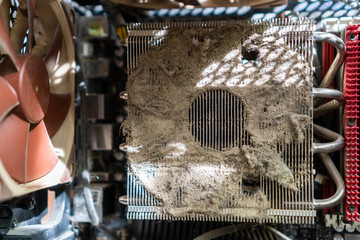Closeup of a CPU heat sink clogged with dust preventing proper airflow. Outdated and abandoned...