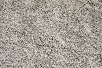 Background of small stones. Stones for construction. Texture, background of white building stone.