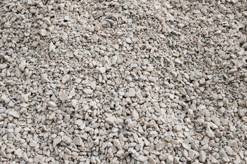 Background of small stones. Stones for construction. Texture, background of white building stone.