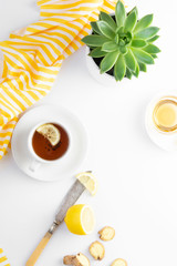 Ginger tea with lemon honey hot autumn, winter drink white background with copy space flat lay.