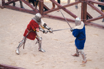 duel of two knights in the sand. medieval reconstruction