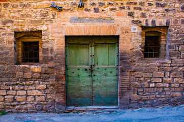 green door and stones