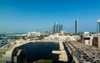 Abu Dhabi skyline view of the downtown buildings rising over the water
