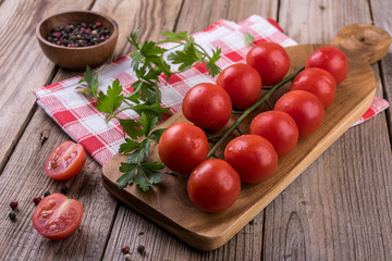tomato sauce and fresh tomatoes on wooden table