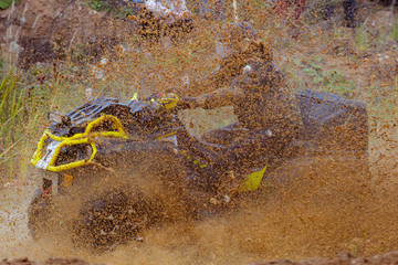 Mud splatter around an ATV in a swamp
