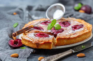 Pie with almond frangipan and organic plums.